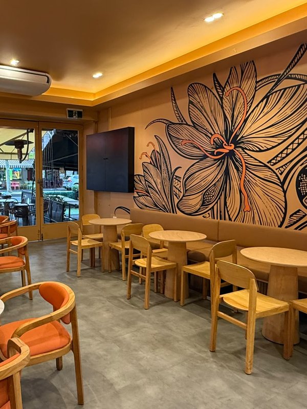 FiLLi Cafe Carlton interior with signature saffron flower mural, Melbourne
