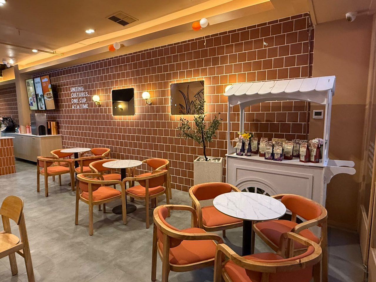 FiLLi Cafe Carlton interior seating and retail cart