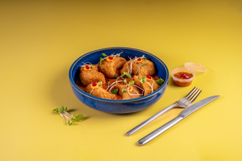 FiLLi Cafe Kurkure Peri Peri Chicken Momos served on a plate